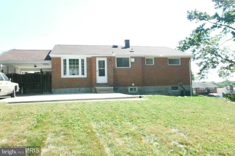 8400 Allison Lane Rosedale, MD 21237 - Photo 2 of 23 a front view of a house with a yard