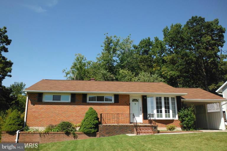 8400 Allison Lane Rosedale, MD 21237 - Photo 3 of 23 a front view of a house with a yard