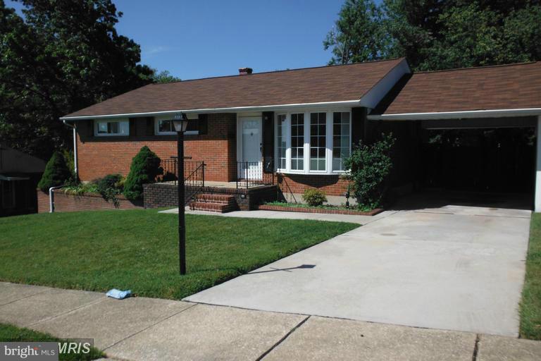 8400 Allison Lane Rosedale, MD 21237 - Photo 4 of 23 a front view of a house with a garden