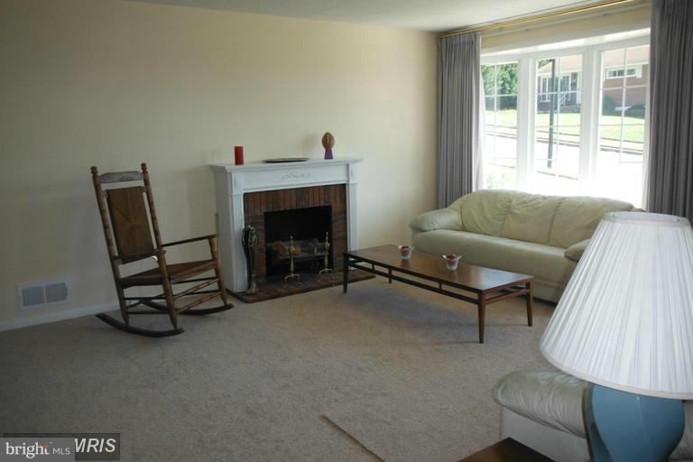 8400 Allison Lane Rosedale, MD 21237 - Photo 8 of 23 a living room with furniture and a fireplace