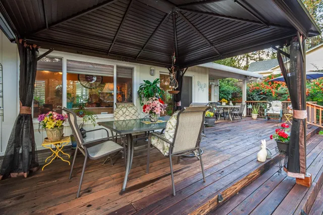 a view of dining room with furniture and garden view