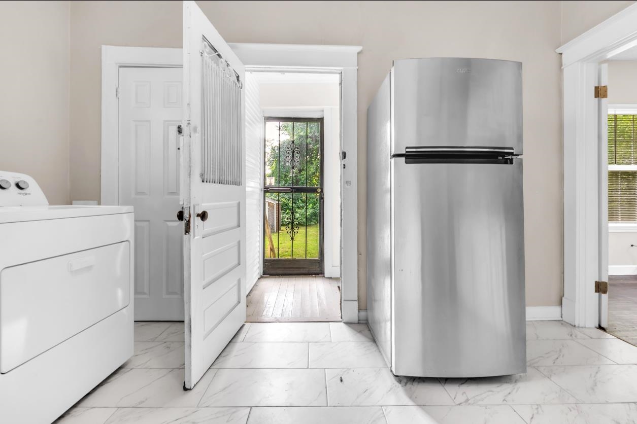 1148 Rozelle Street Memphis, TN 38106 - Photo 12 of 16 a view of a storage & utility room with closet dryer