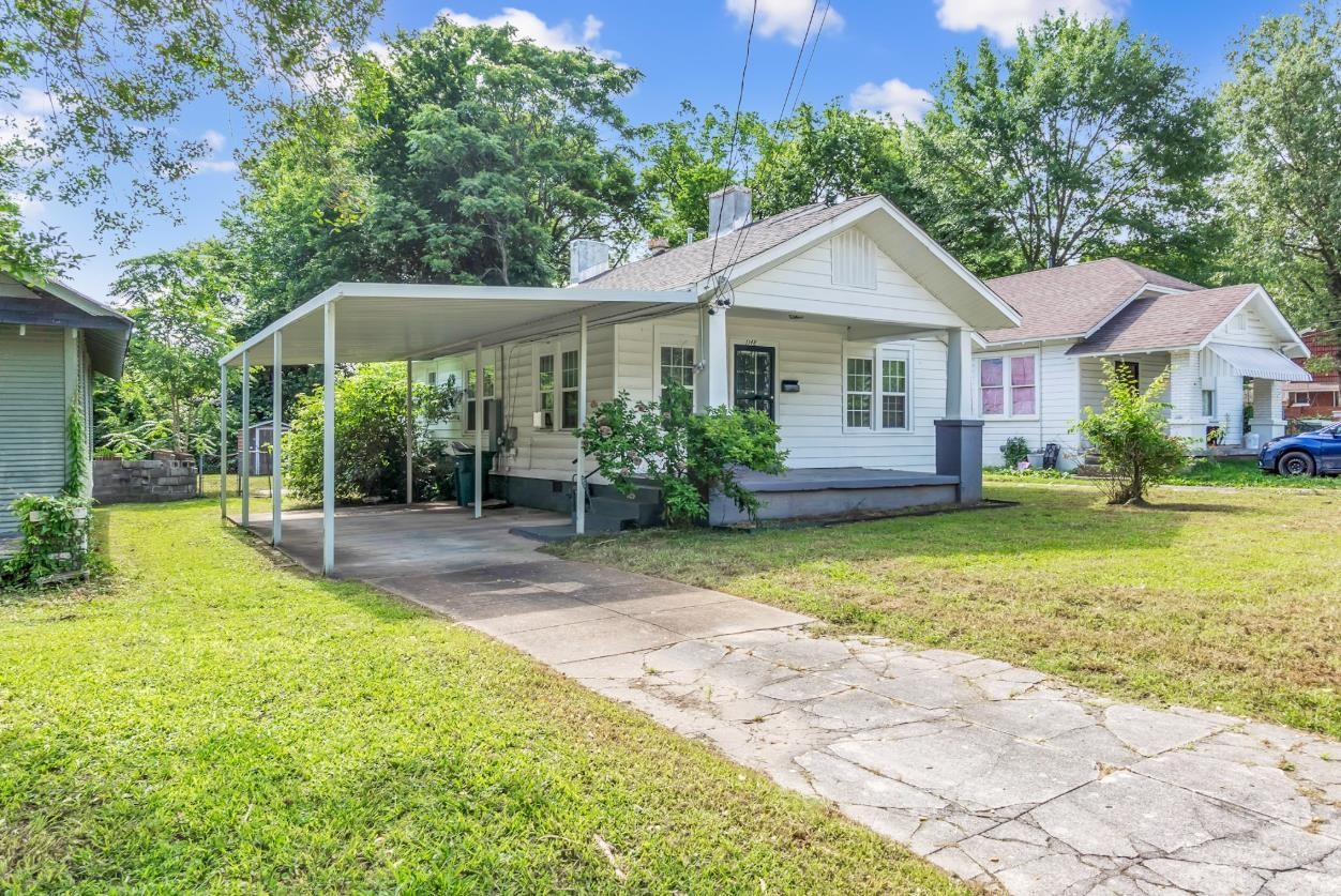 1148 Rozelle Street Memphis, TN 38106 - Photo 2 of 16 a front view of a house with garden