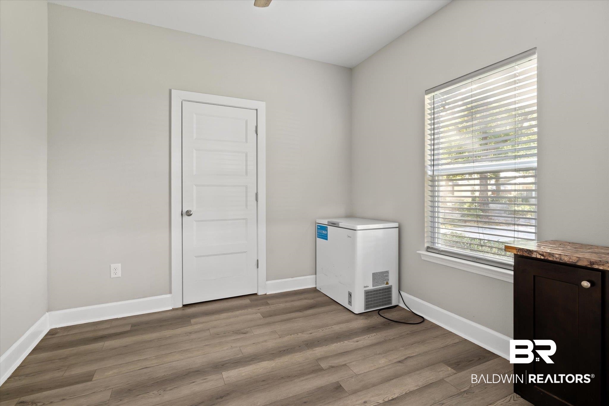 708 Fisher Street Mobile, AL 36607 - Photo 16 of 17 Spare room featuring light wood-type flooring