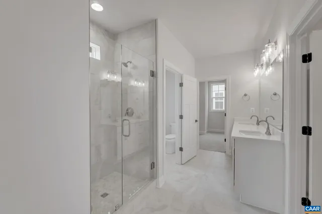 a bathroom with a shower and a sink