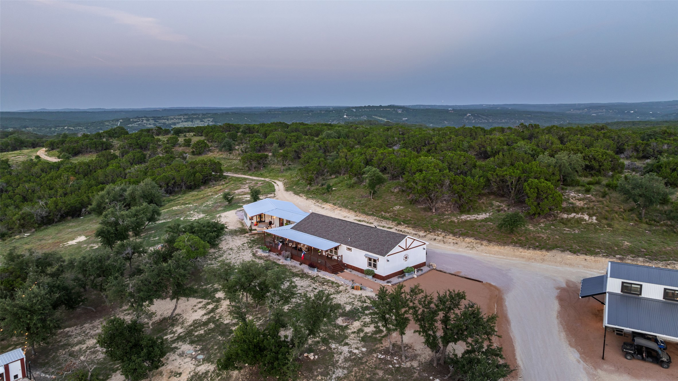 830 Ulrich Road Johnson City, TX 78636 - Photo 38 of 40 Perched atop a hill, this dwelling offers expansive, tree-dotted views and generous outdoor living areas.