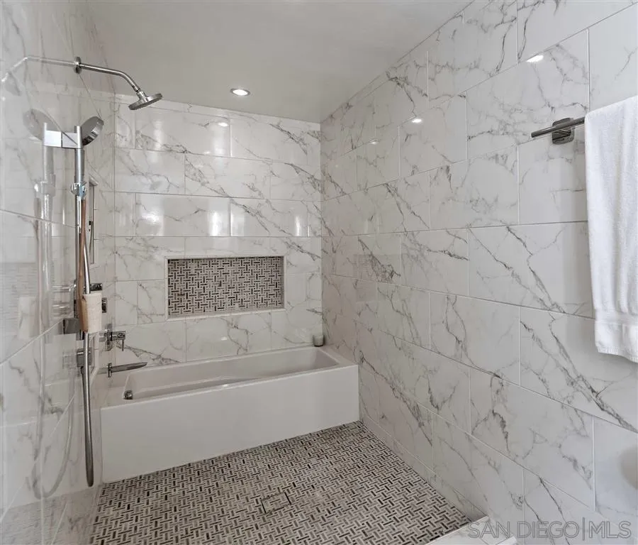 1228 Cave Street La Jolla, CA 92037 - Photo 14 of 22 a bathroom with a bathtub and a shower