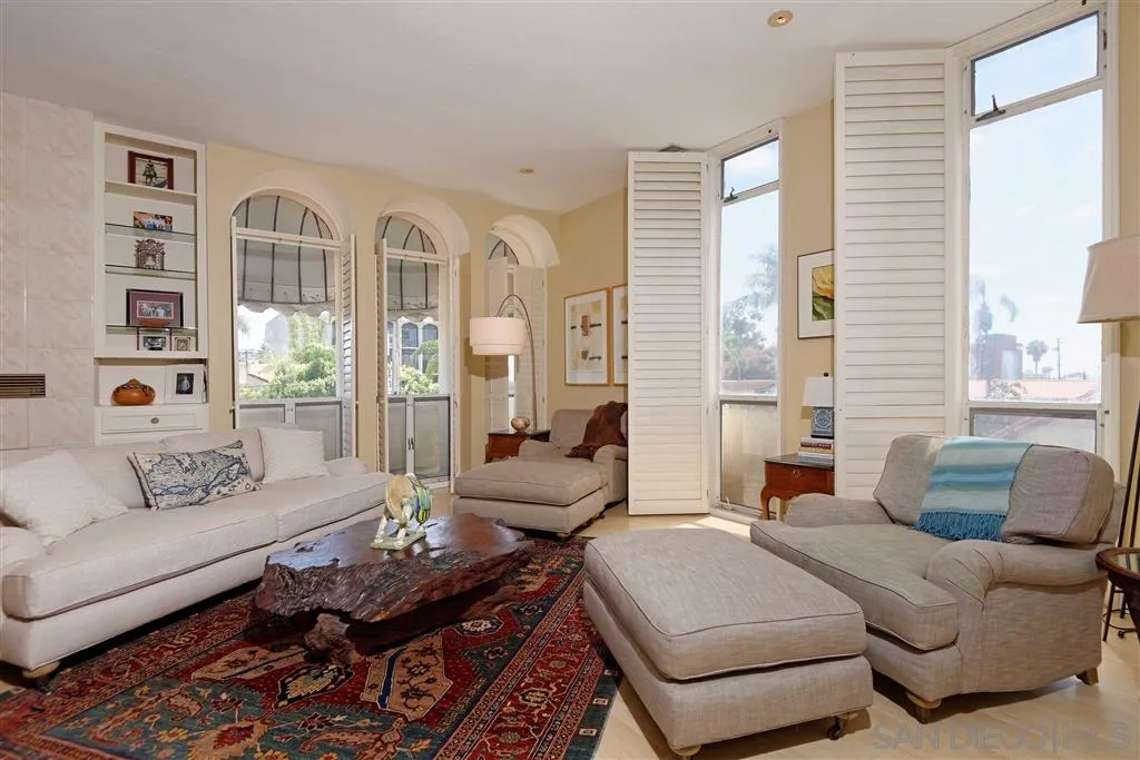 1228 Cave Street La Jolla, CA 92037 - Photo 3 of 22 a living room with furniture fireplace and a large window