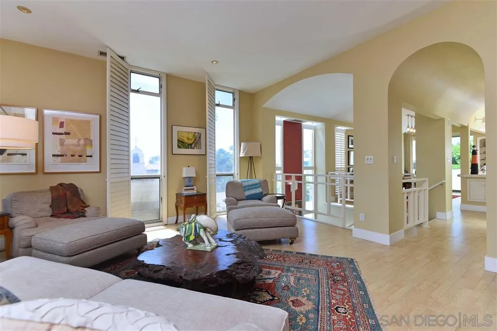 1228 Cave Street La Jolla, CA 92037 - Photo 4 of 22 a living room with furniture and wooden floor