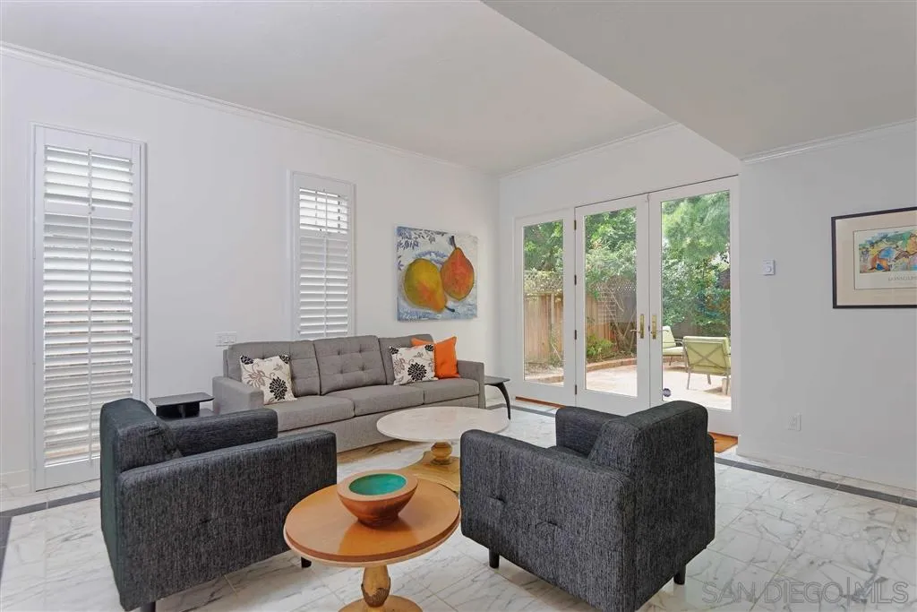 1228 Cave Street La Jolla, CA 92037 - Photo 9 of 22 a living room with furniture and a large window