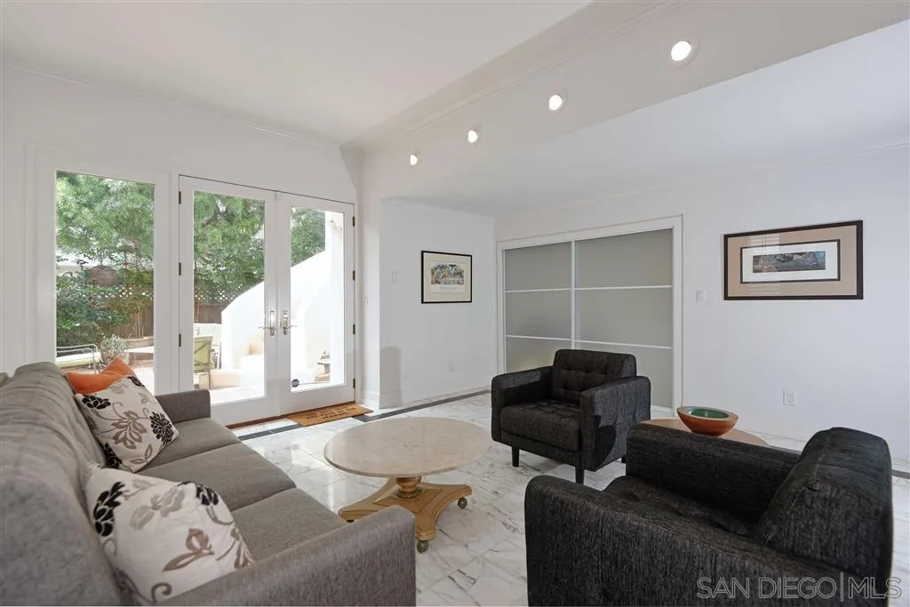 1228 Cave Street La Jolla, CA 92037 - Photo 10 of 22 a living room with furniture and a large window