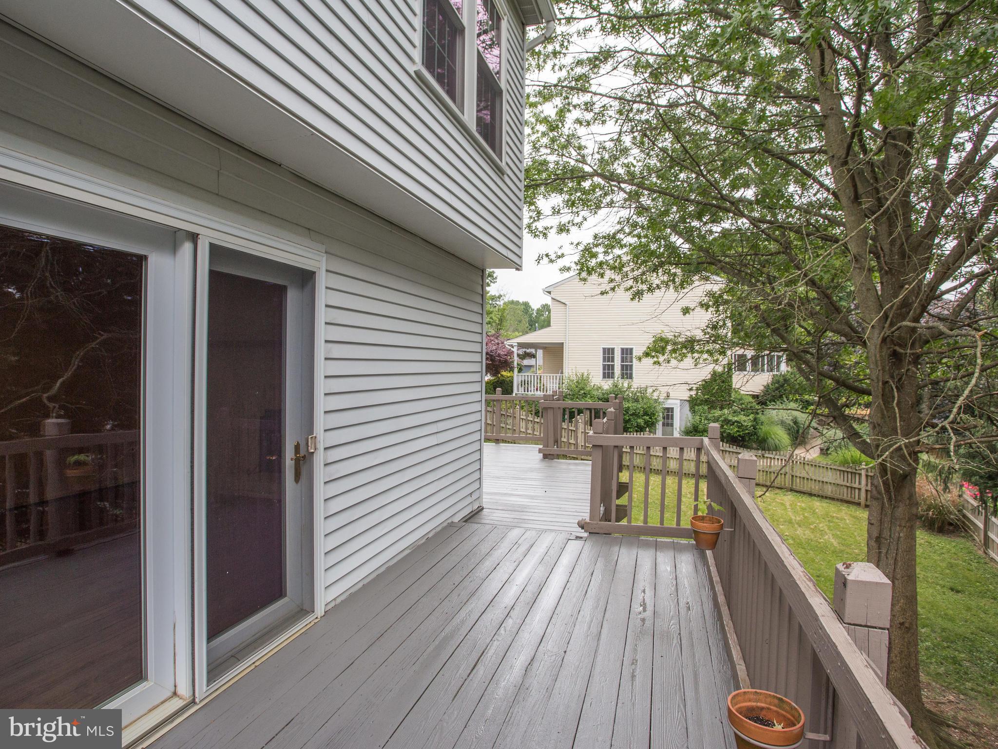 288 Raintree Drive Arnold, MD 21012 - Photo 27 of 30 Deck wraps around the side of the house.