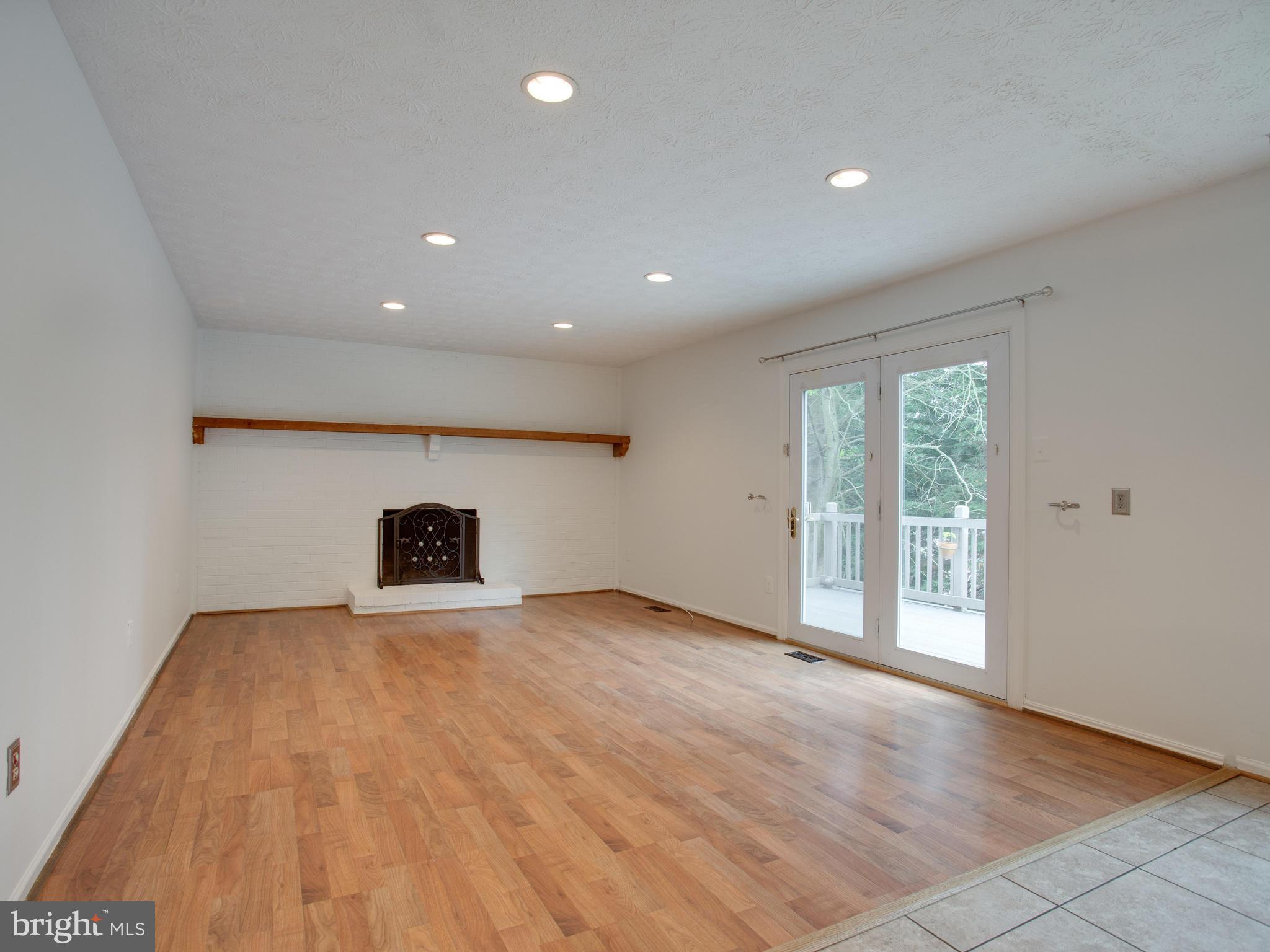 288 Raintree Drive Arnold, MD 21012 - Photo 9 of 30 Fireplace & French doors to deck.