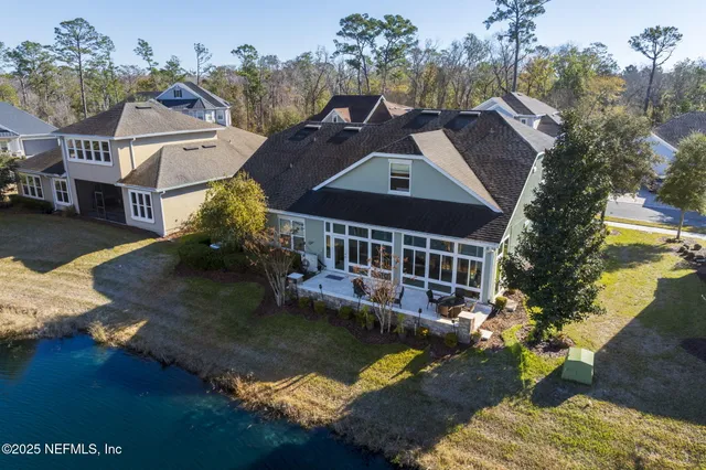 a view of a lake with a house in the background
