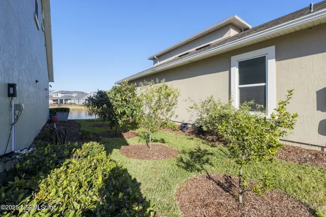 a view of a hallway with a livingroom and a hallway
