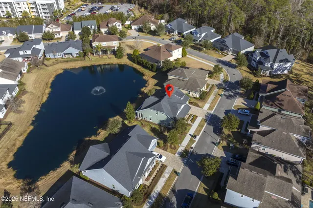 an aerial view of a house with a swimming pool