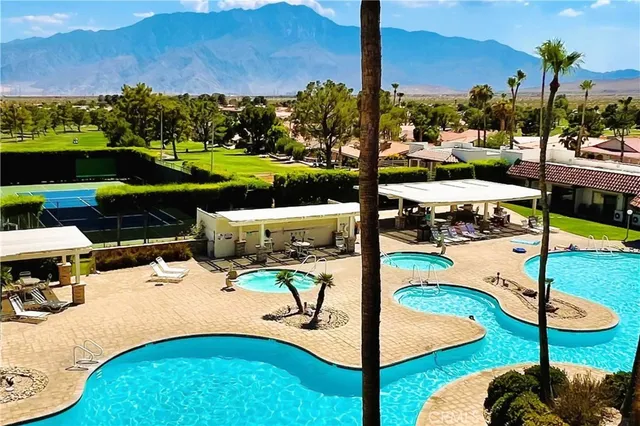 a view of an outdoor space pool patio and outdoor seating