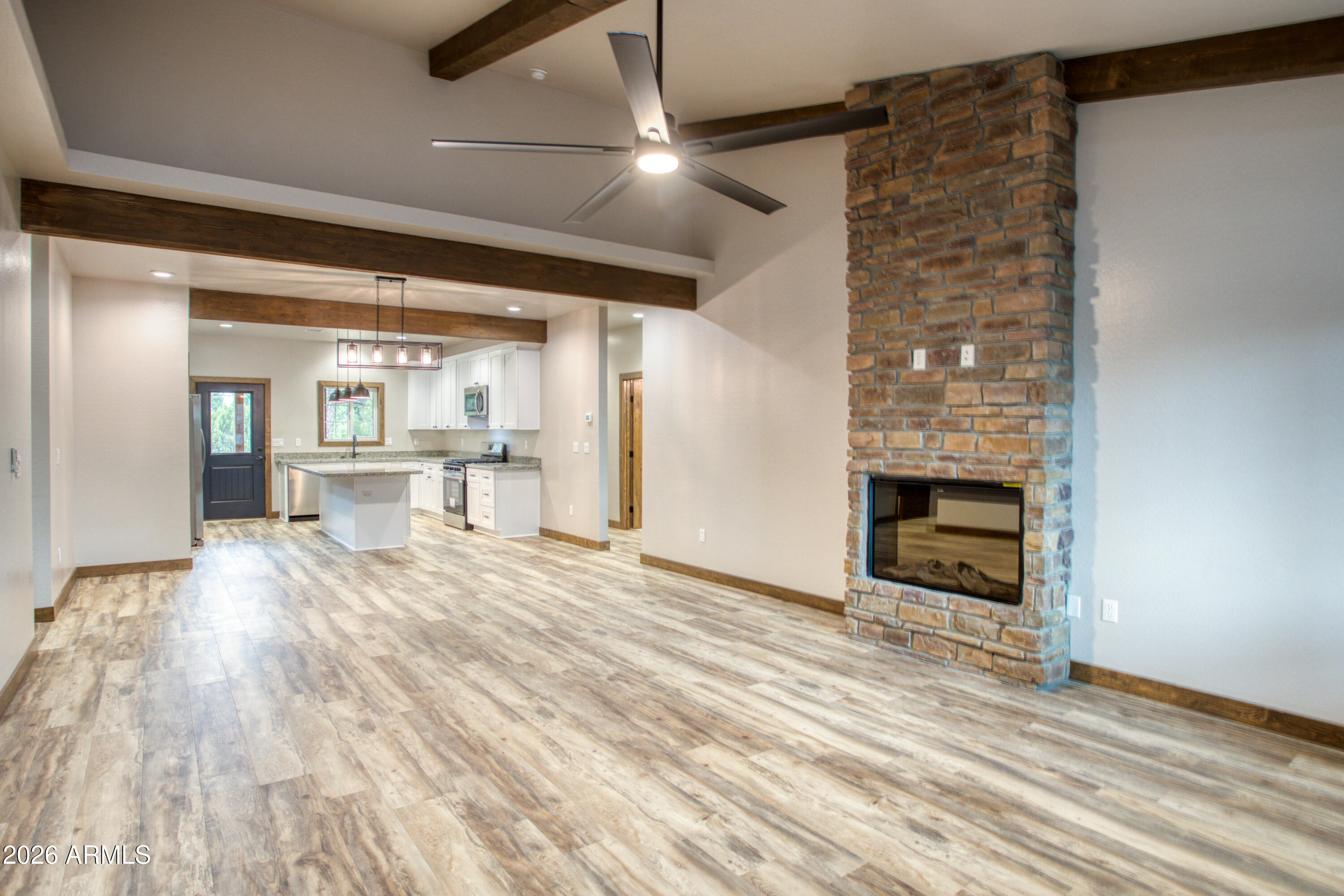 620 Campbell Lane Show Low, AZ 85901 - Photo 8 of 52 a view of a livingroom with a fireplace