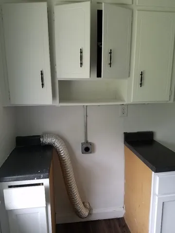 a kitchen with a sink and a stove