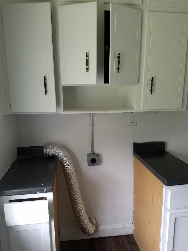 4023 6th Avenue Columbus, GA 31904 - Photo 8 of 9 a kitchen with a sink and a stove