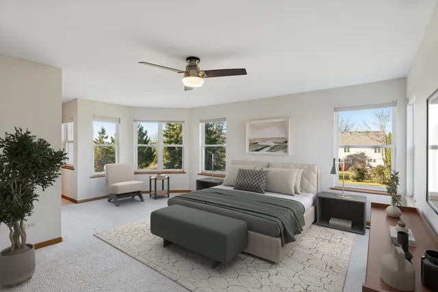 a bedroom with a large bed and a couch