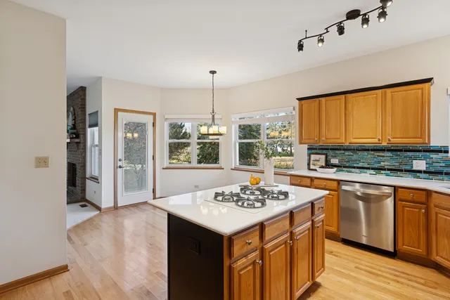 a kitchen with a sink stove and refrigerator