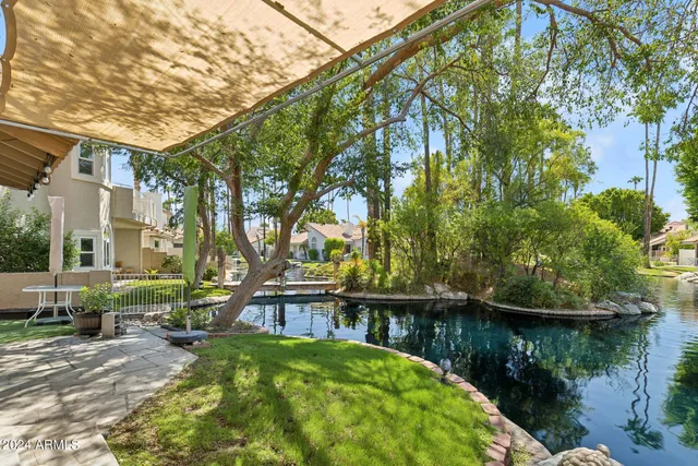 a view of house with outdoor space and sitting area