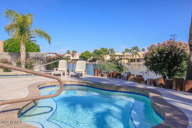 a view of a swimming pool with a patio