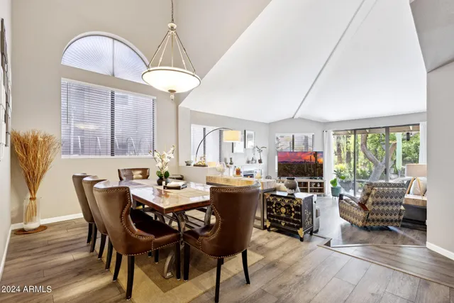 a view of a dining room with furniture window and outside view