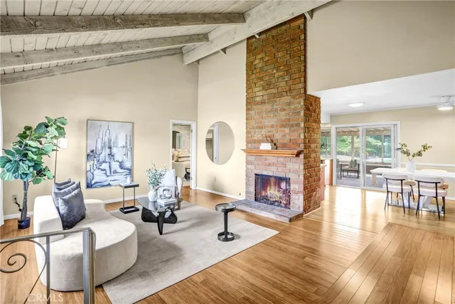 a living room with fireplace furniture and a fireplace
