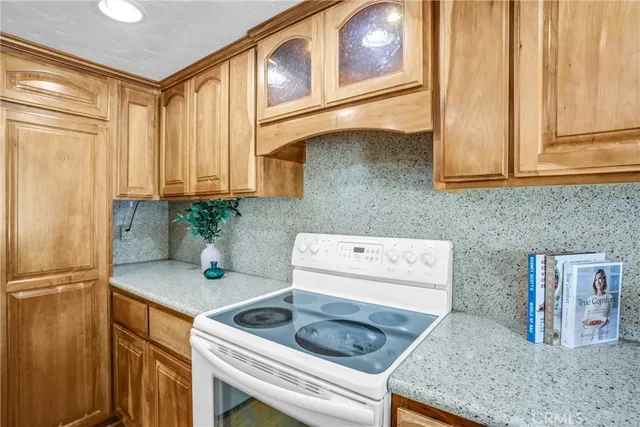 a kitchen with a sink stove and refrigerator