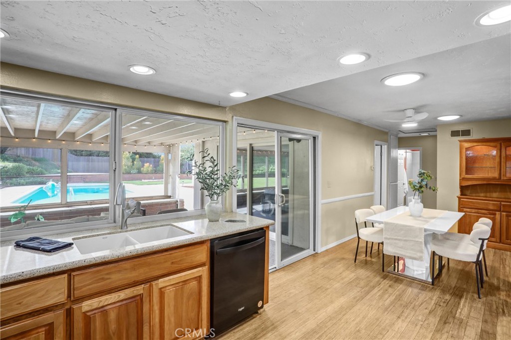 1103 Moonlight Summit Drive Diamond Bar, CA 91765 - Photo 11 of 31 Indoor-outdoor entertaining made easy bright kitchen/dining with sliders and a clear view to the covered patio and pool.