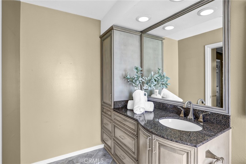 1103 Moonlight Summit Drive Diamond Bar, CA 91765 - Photo 14 of 31 Polished vanity space with granite counters, generous storage, and bright, modern lighting.
