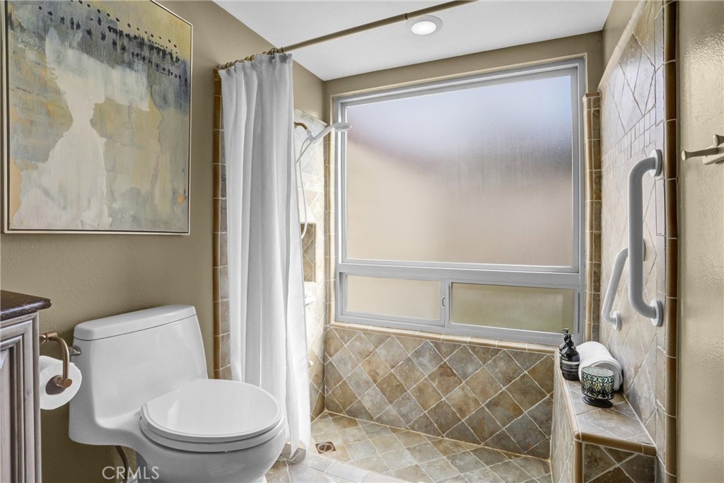 1103 Moonlight Summit Drive Diamond Bar, CA 91765 - Photo 15 of 31 Spa-style bath featuring a custom tiled shower and oversized frosted window for natural light & privacy.