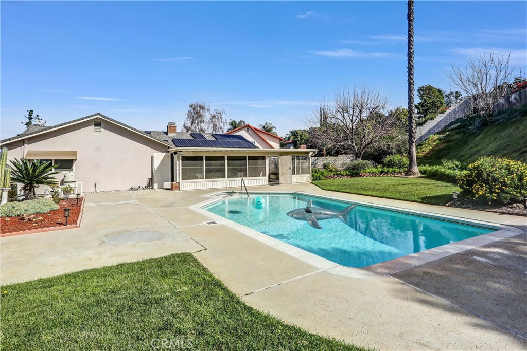 1103 Moonlight Summit Drive Diamond Bar, CA 91765 - Photo 26 of 31 Backyard made for weekends—a wide pool deck, open lawn, and covered patio for easy gatherings.
