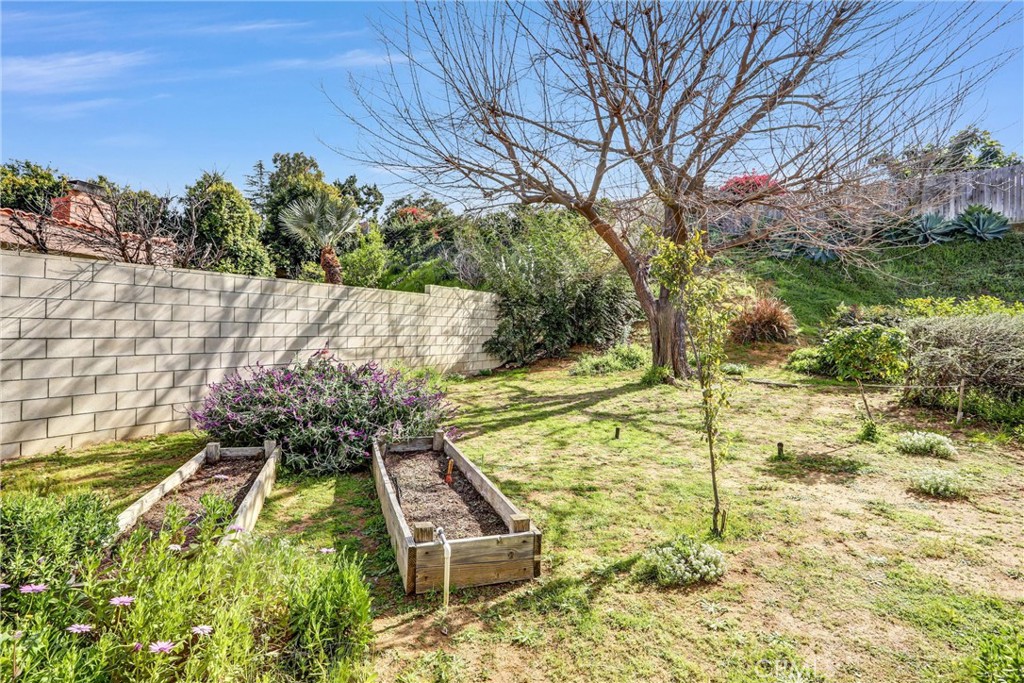 1103 Moonlight Summit Drive Diamond Bar, CA 91765 - Photo 29 of 31 Garden lover’s backyard retreat with raised planting beds, mature shade tree, and plenty of space to create your own outdoor oasis.