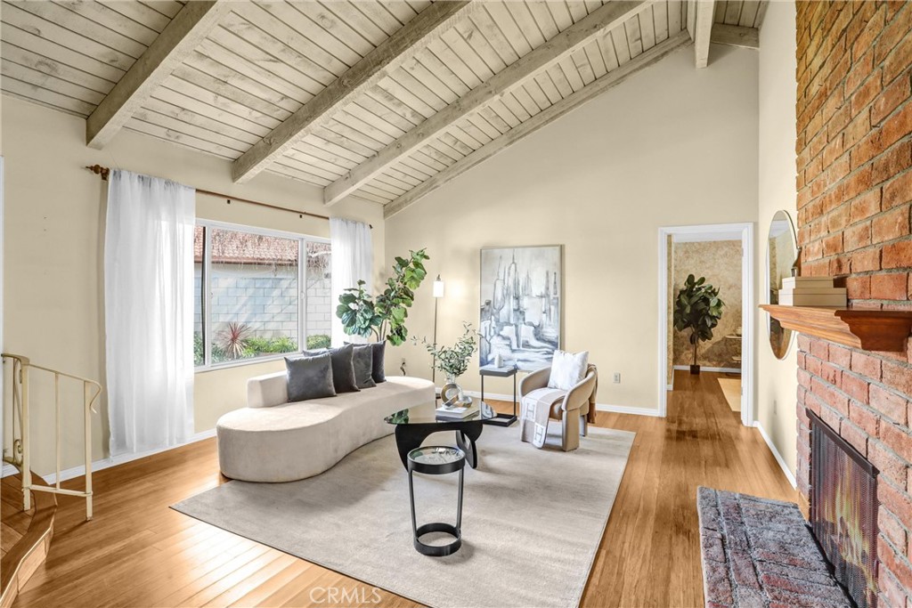 1103 Moonlight Summit Drive Diamond Bar, CA 91765 - Photo 5 of 31 Dramatic, open great room featuring a statement brick fireplace and effortless flow to the patio.