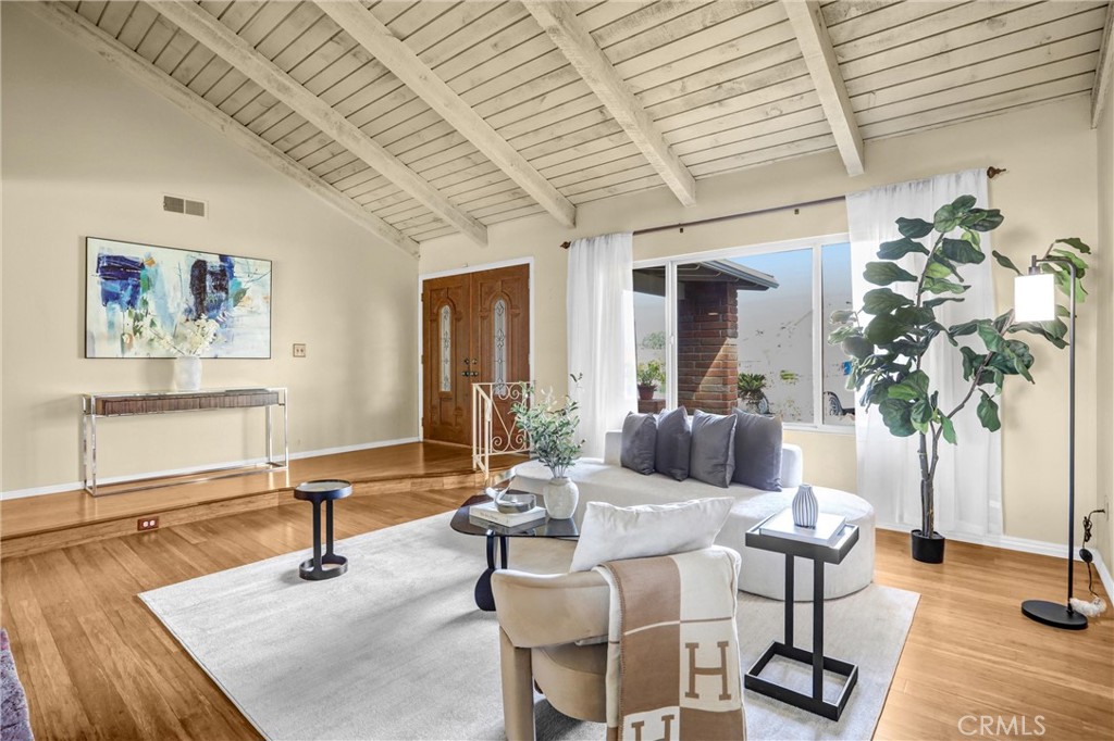 1103 Moonlight Summit Drive Diamond Bar, CA 91765 - Photo 6 of 31 Light-filled living space with vaulted beam ceilings that make the room feel expansive and airy.