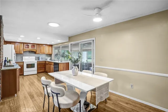 a kitchen with a table and chairs in it