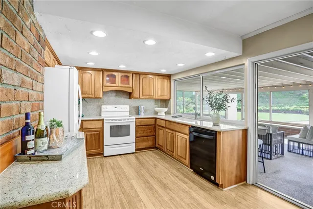 a kitchen with stainless steel appliances granite countertop a stove and a sink