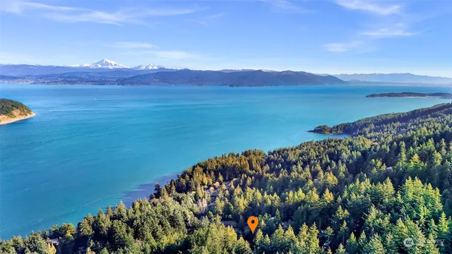 a view of mountain with wooden floor and a mountain in the background