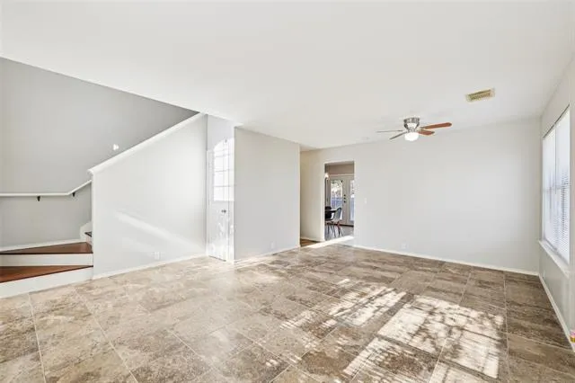 a view of a big room with closet and windows