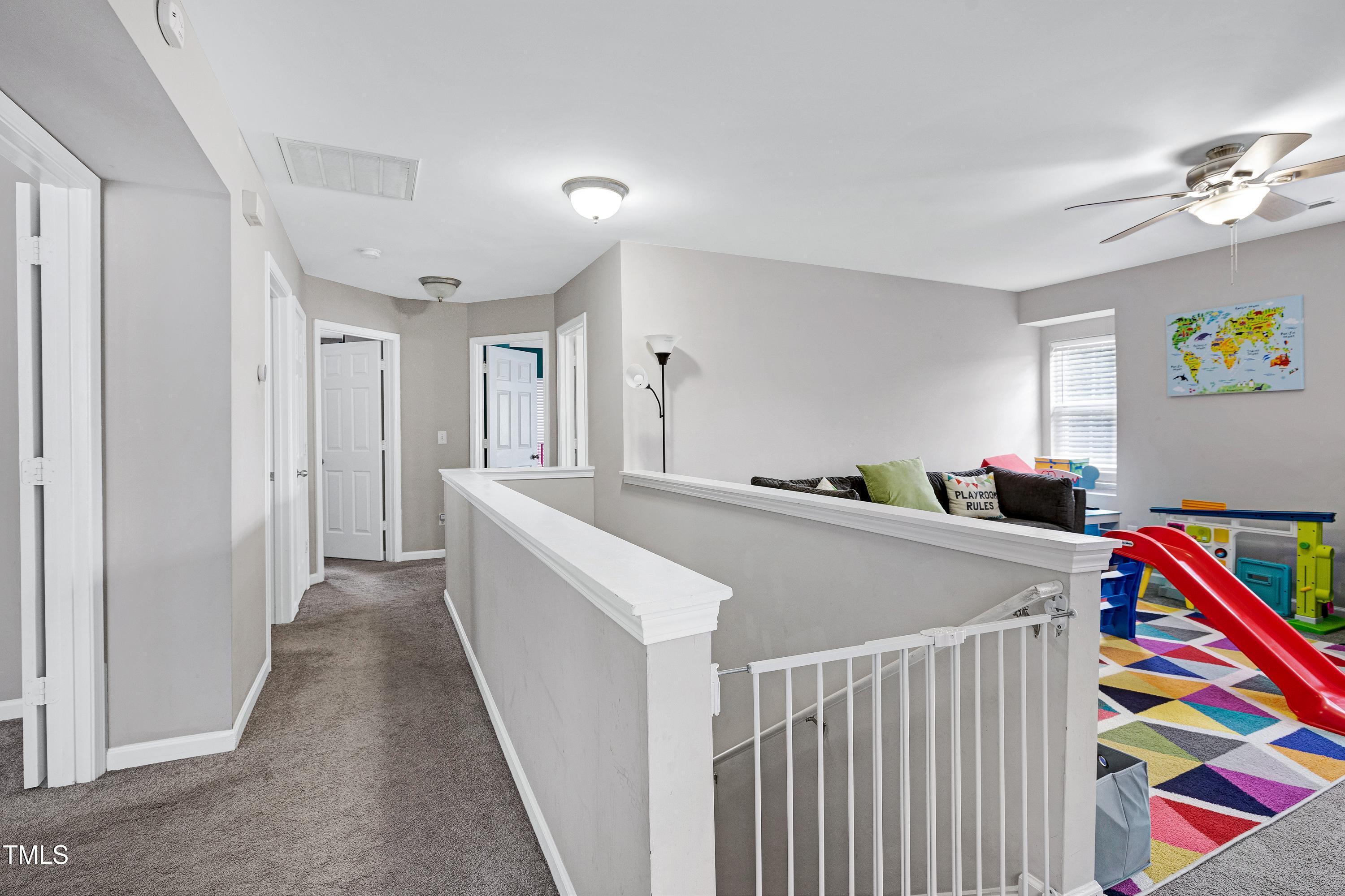 5428 Meryton Park Way Raleigh, NC 27616 - Photo 13 of 29 a view of hallway with furniture and toys