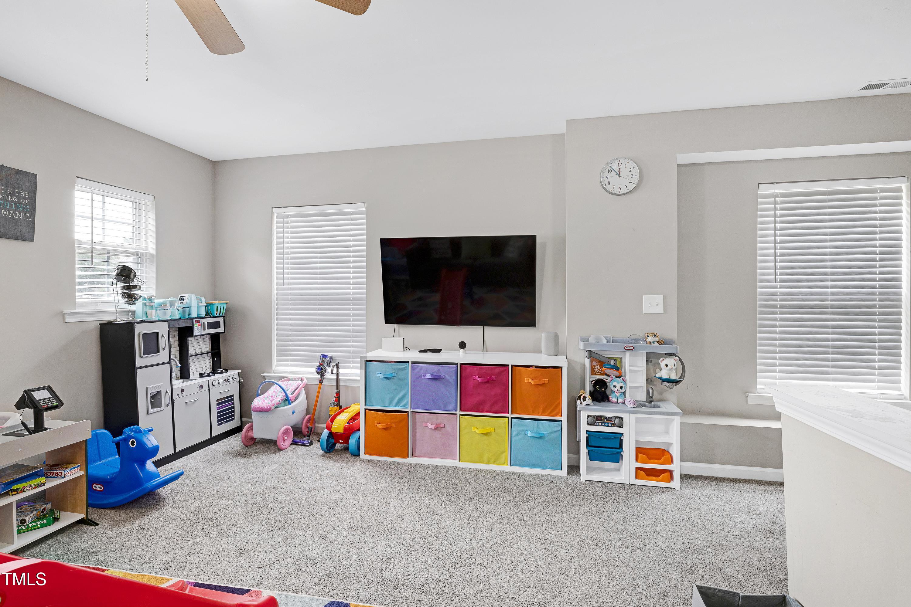 5428 Meryton Park Way Raleigh, NC 27616 - Photo 16 of 29 a living room with furniture and a flat screen tv