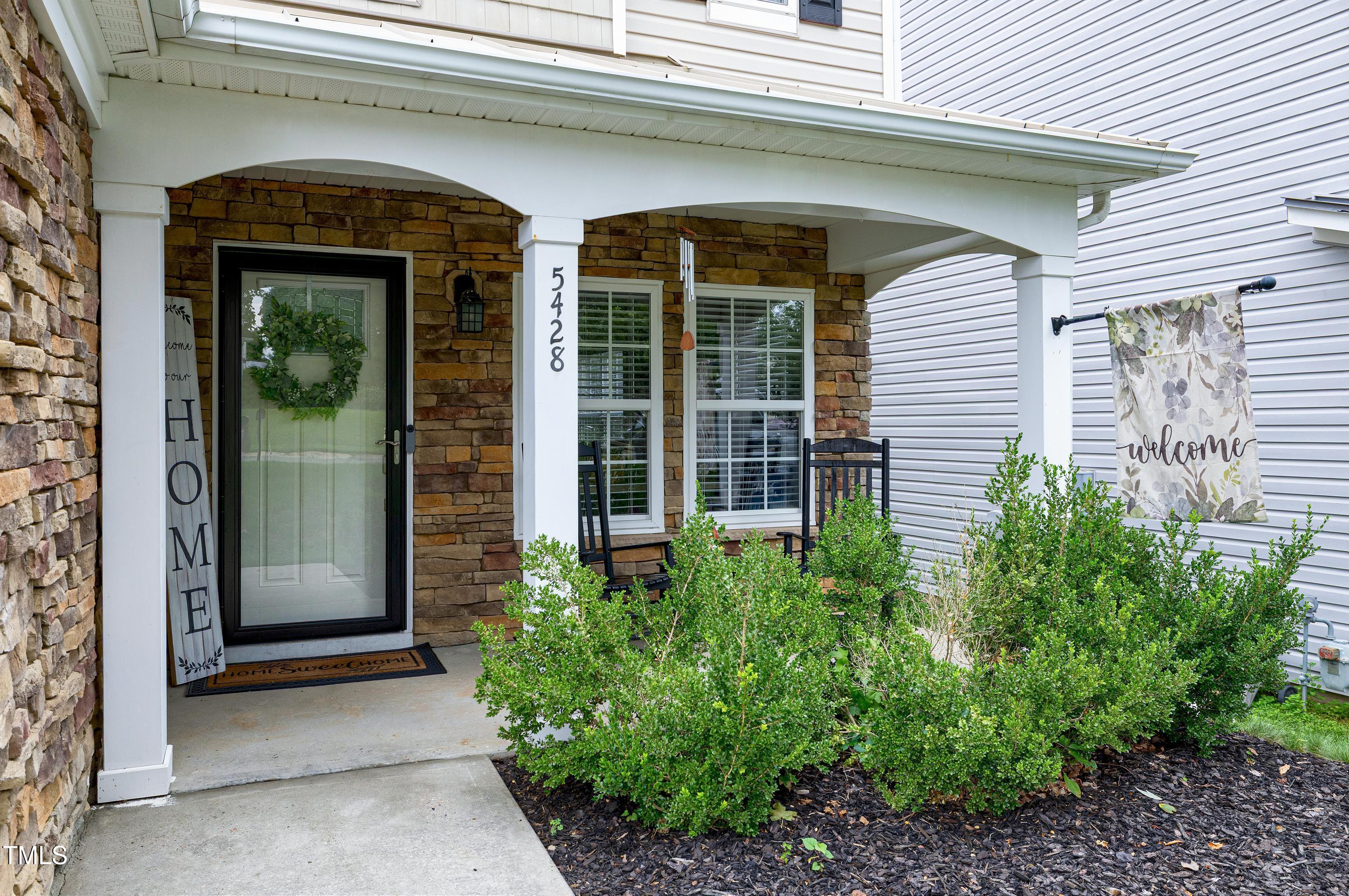 5428 Meryton Park Way Raleigh, NC 27616 - Photo 2 of 29 a view of a entryway door of the house