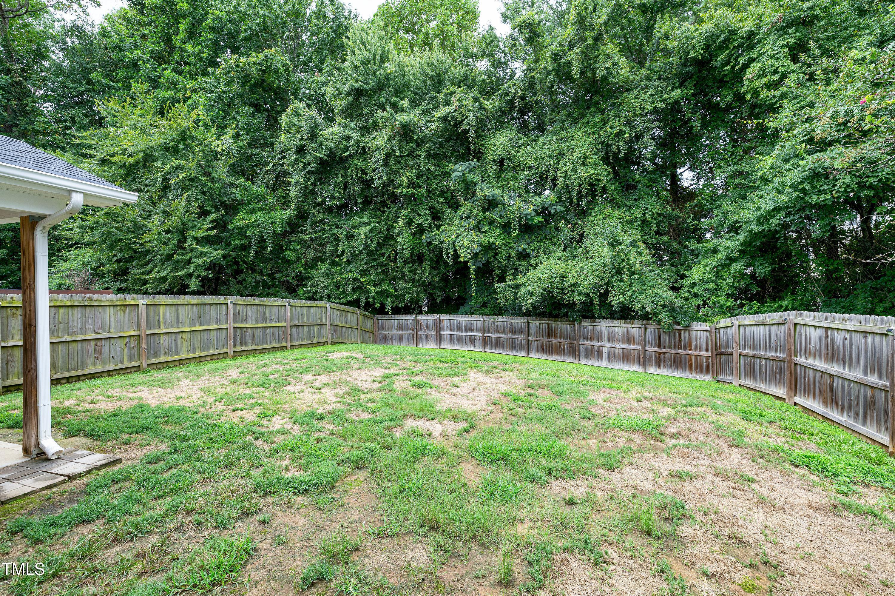 5428 Meryton Park Way Raleigh, NC 27616 - Photo 27 of 29 a swimming pool with some trees in the background