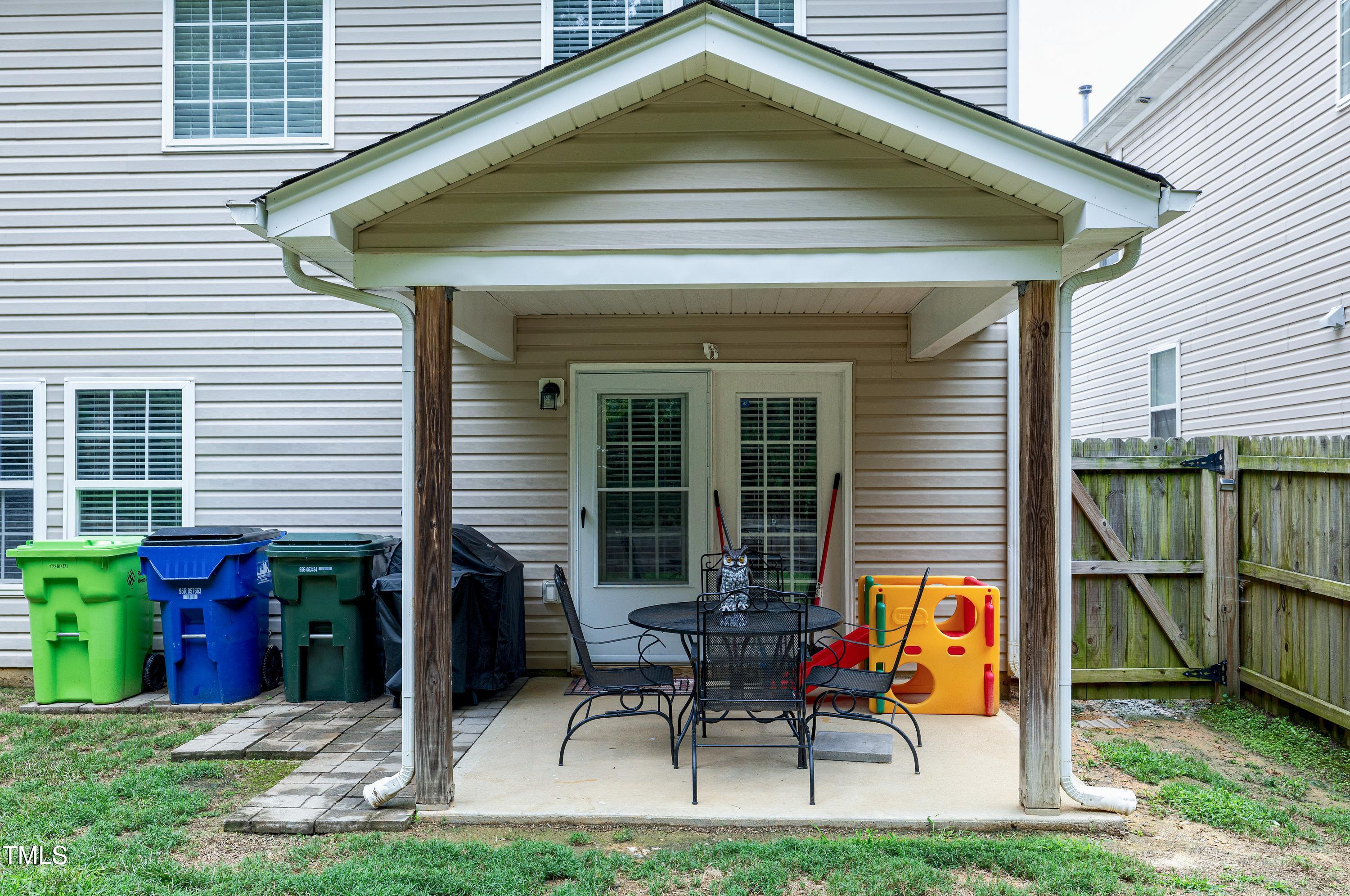 5428 Meryton Park Way Raleigh, NC 27616 - Photo 29 of 29 a view of backyard with a chair and table