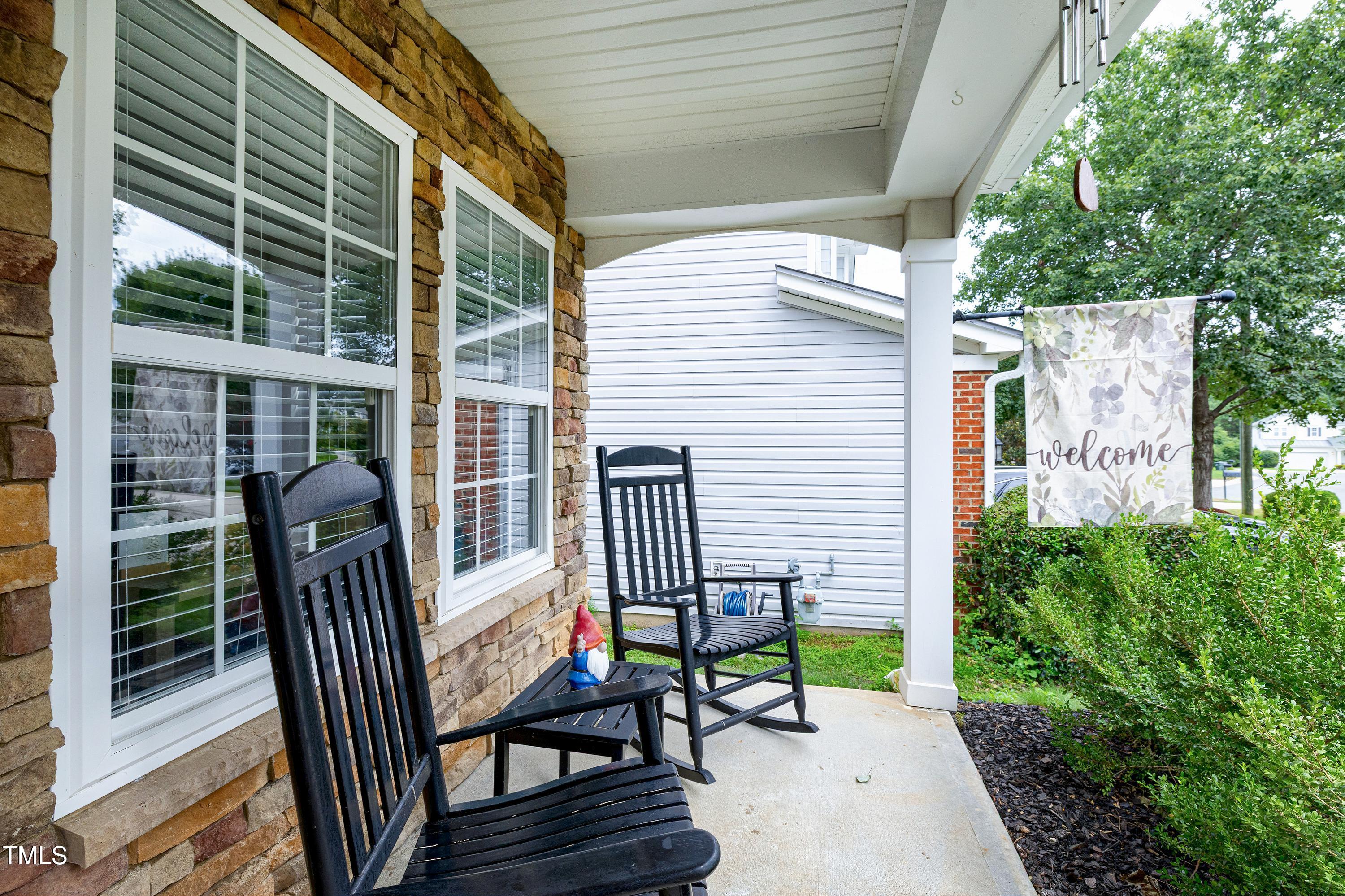 5428 Meryton Park Way Raleigh, NC 27616 - Photo 3 of 29 a view of a chair and table in the balcony