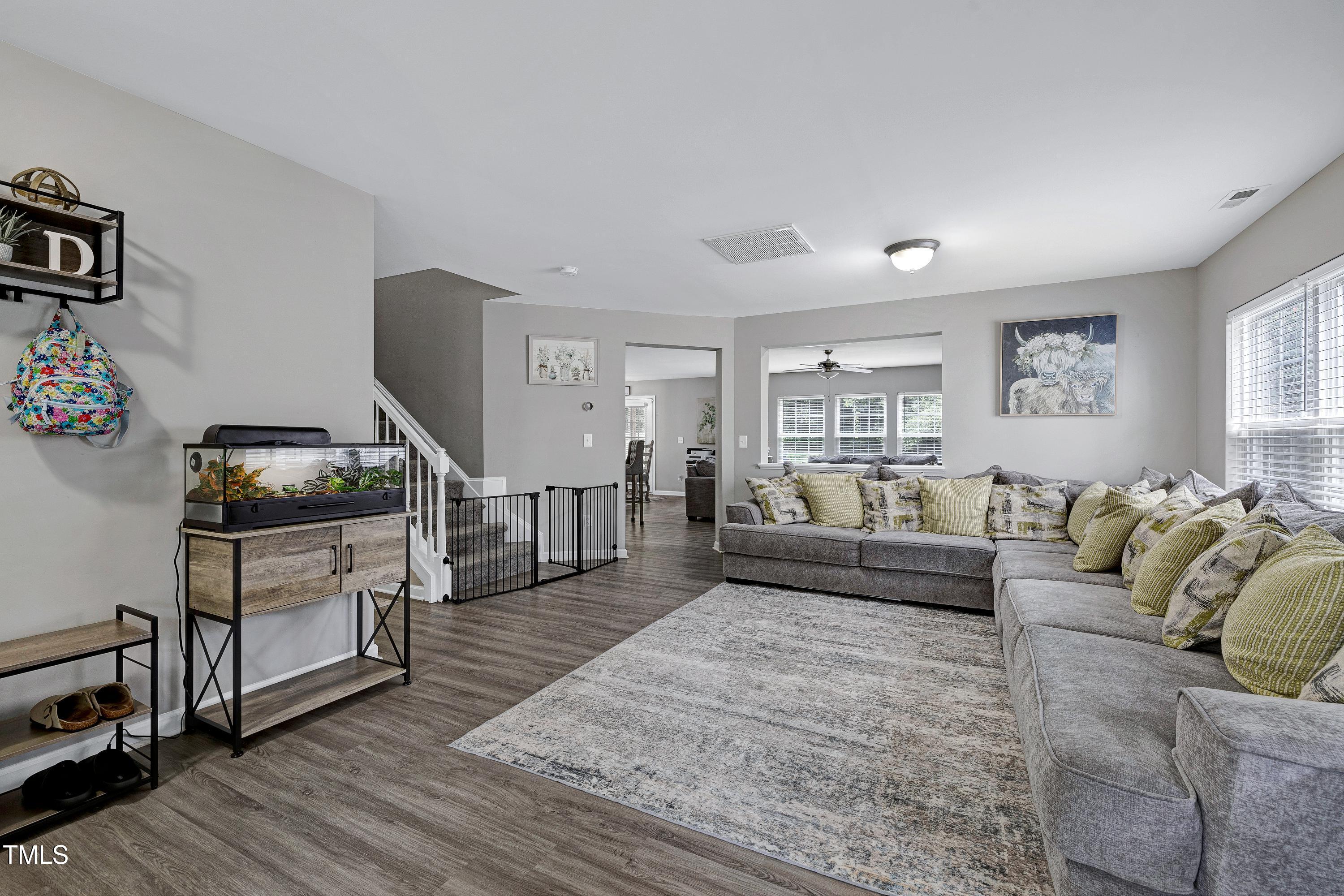 5428 Meryton Park Way Raleigh, NC 27616 - Photo 6 of 29 a living room with furniture and a wooden floor