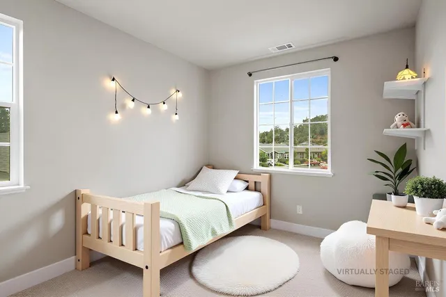 a bedroom with a bed and window